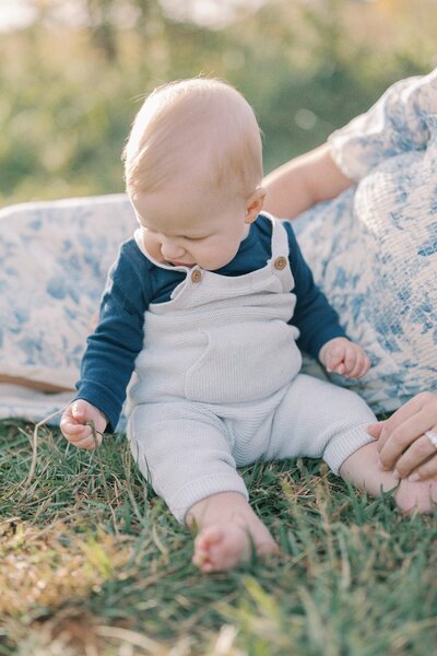 baby-playing-in-grass