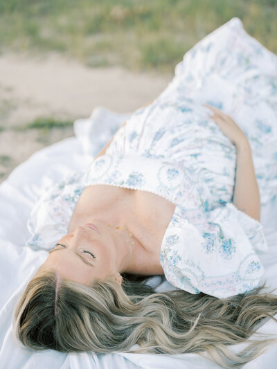 Closeup of mom with pregnant belly holding toddler sibling by Maternity Photographer Richmond VA