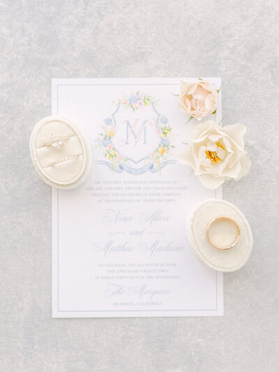 Wedding Essentials Flatlay: Invitation, Rings, and Flowers