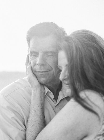 Husband and wife hold each other close for anniversary session in Louisville Kentucky photographed by Lexington Kentucky film photographer Magnolia Tree Photo Company