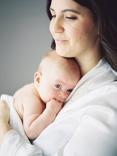 Mother holding baby on her chest for Richmond Family Photos