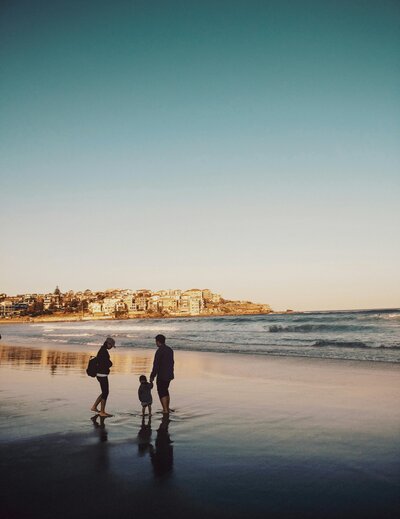 Family Vacation on the Beach with a Blue Sky