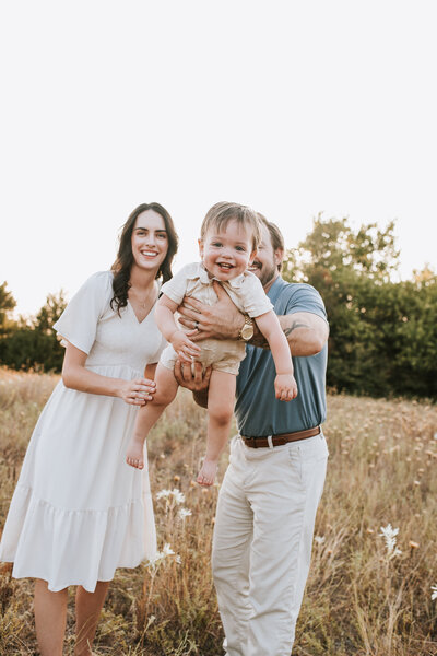 family photography session at denton clear creek natural heritage center featuring mom, dad, and toddler