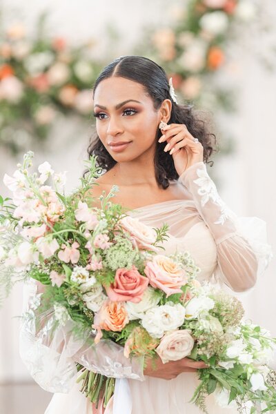 Bride holding lush bouquet