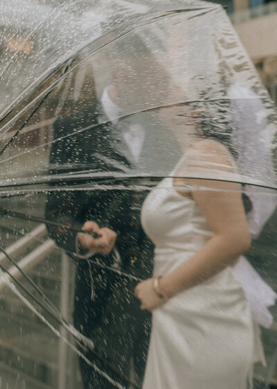 Couple kissing down the aisle at Hyatt Lake Washington rooftop ceremony
