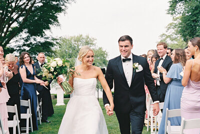 Wedding couple leave ceremony at Glen Manor in Portsmouth, RI