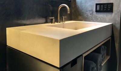 Custom concrete sink with deep profile for a residential bathroom