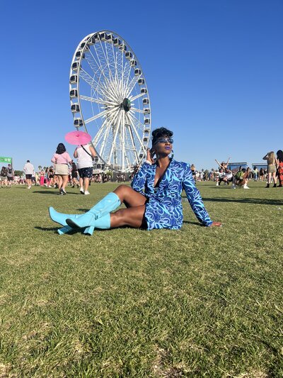 Woman posing with Coachella ferris wheel