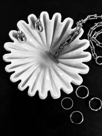 Bowl with jewels and necklaces, earrings and rings. photo by AMALYN STYLE + SOCIAL 