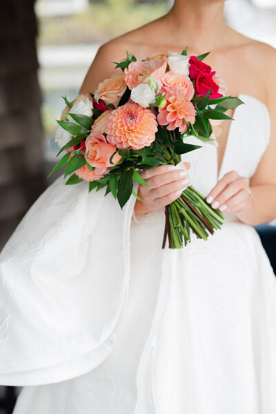 bride holding colorful and vibrant bridal bouquet