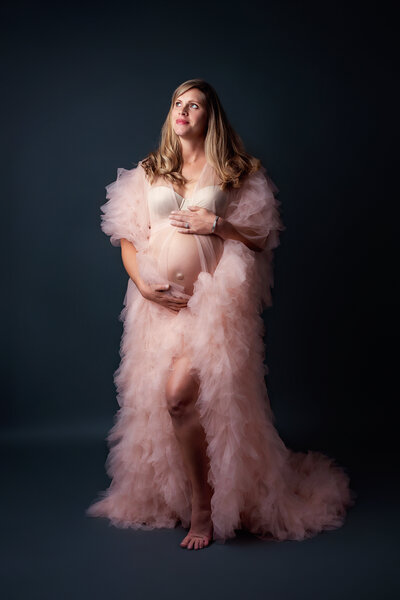 studio maternity with pink fluffy flowy dress
