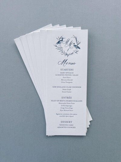 Tea-length blue letterpress menu cards with custom monogram crest