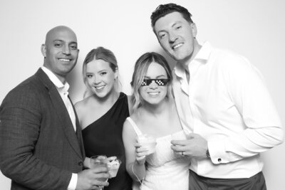 Couple pose with their dog at their wedding reception in Vancouver