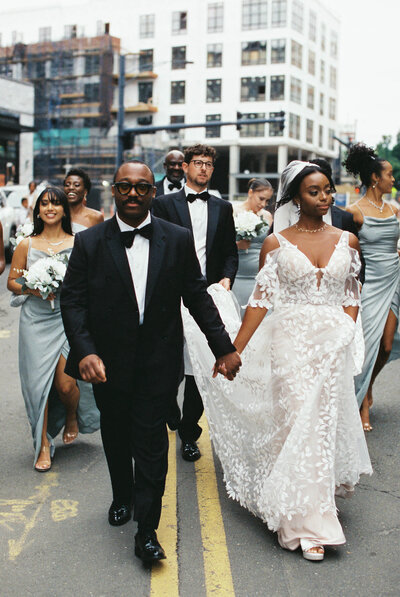 Black couple holding hands at Hudson river
