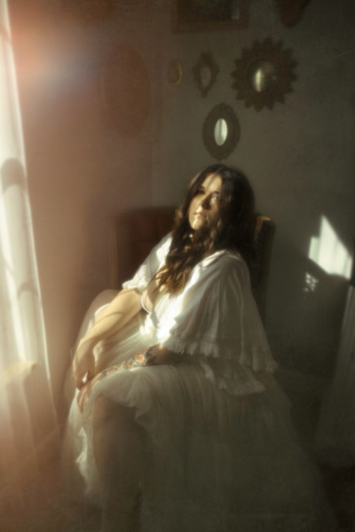 woman sitting in a chair in the sunlight