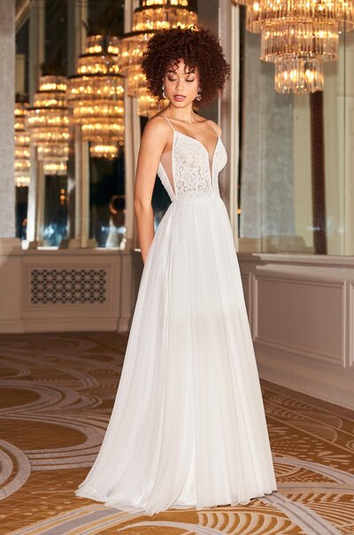 This feminine straight-cut gown is elegant and classy. The Chantilly Lace bodice features the most delicate lace appliqué that extends from the bodice down to the side slit in the front, and along the centre back of the dress. The back of the gown has a flattering low cut with simple spaghetti straps. The fit-and-flare skirt accentuates your figure, giving you a slender silhouette.