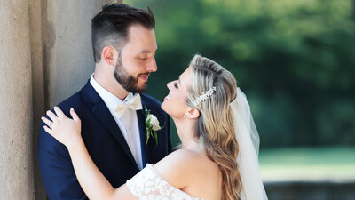 Bride and groom looking into each others eyes at Waterfront Mansion wedding in Long Island New York