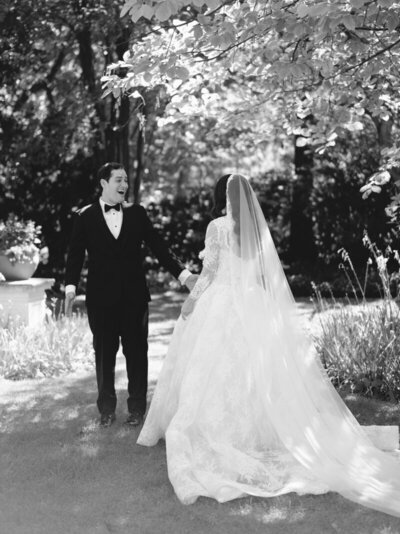 First look on wedding day and groom being shocked at his bride.