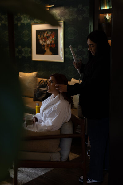 Tahirah working on her rose gold Macbook