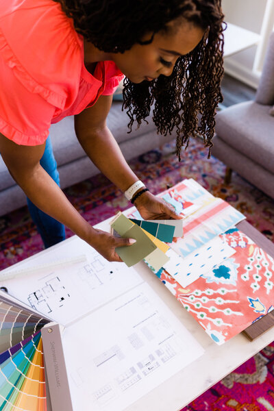 woman looking through color swatches
