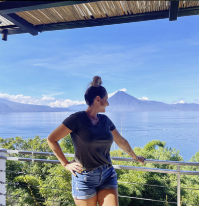 Meet Vanessa, your Costa Rica Travel Specialist, as she admires the breathtaking Arenal Volcano. Let her expertise guide your unforgettable journey.