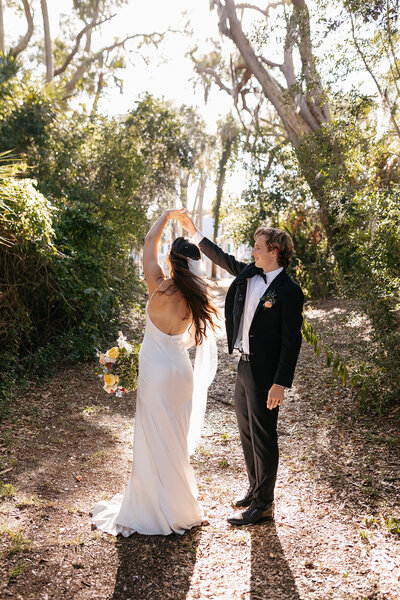 indie west photo portfolio image of bride and groom walking on wedding day