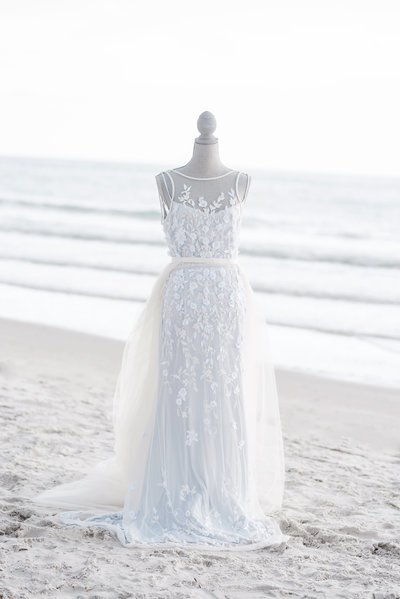 Beautiful wedding dress on mannequin on a beach