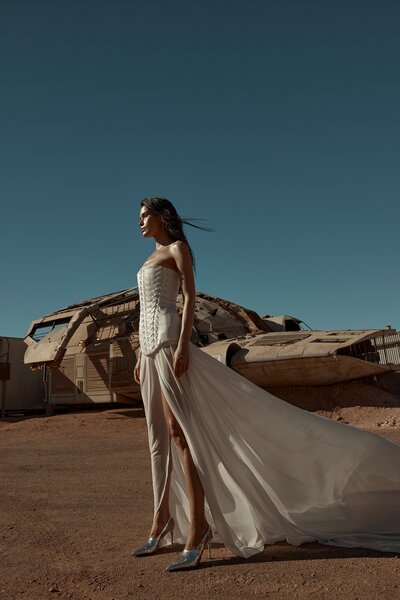 KYHA BRIDE 'BASSETT' stocked at Sunday's Bride London, UK. The sheer power of Bassett. Ethereal yet grounded in strength, Bassett is crafted from light layers of chiffon to see you float through your big day. Featuring a statement split, pair Bassett with the Ford corset for the ultimate in dichotomous dressing.