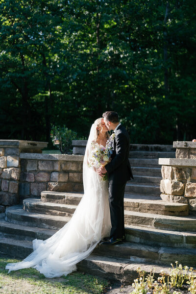 Bride and groom walk up memorial steps at their DC wedding