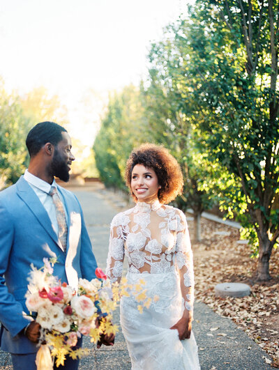 a wedding ring in a vintage case with a paper full of calligraphy by colorado wedding photographer JKG photography