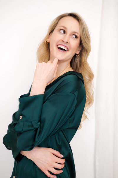 Valerie Greene headshot in green blouse on white background