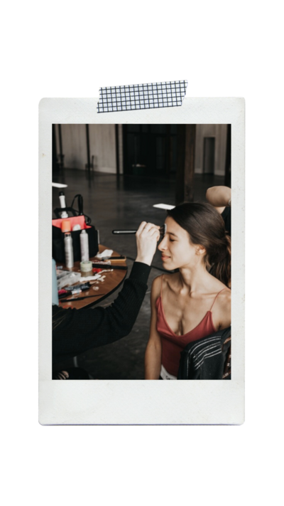 Polaroid of makeup artist doing bridal makeup