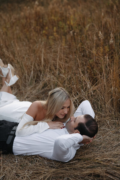 yosemite session, adventure session in yosemite, bride laying on groom, couple on the ground 