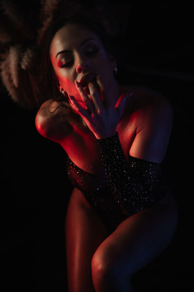 Boudoir photography woman in lingerie sitting on floor in Lubbock, Texas photographer in Amarillo TX