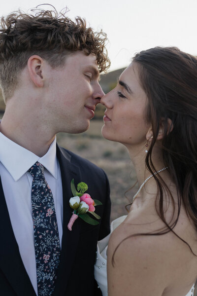 Bride and groom are posing for their portraits during their intimate elopement in northern Colorado. Captured by a Minnesota based wedding and elopement photographer.