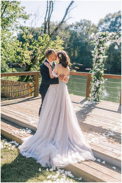 Lake Tahoe wedding photographer captures bride and groom embracing after Lake Tahoe wedding ceremony