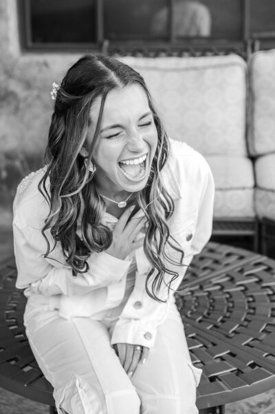 Phoenix-Wedding-Photographer-and-Videographer-Bride-laughing-while-getting-ready-YarWed-1081