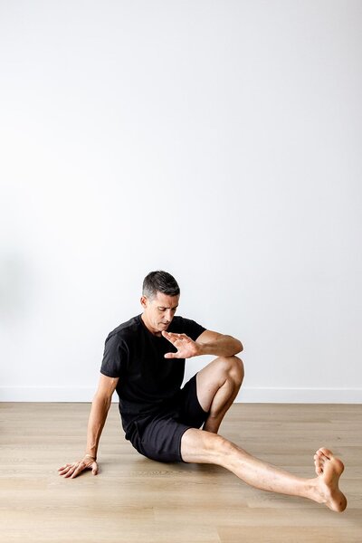 Chris Warden, founder of Embody Health & Performance, Doctor of Physical Therapy stretching