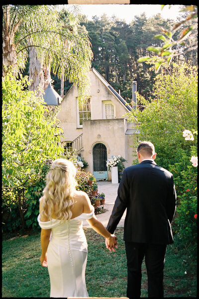 bride and groom embrace on wedding day in adelaide