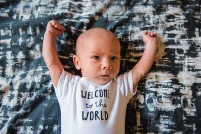 Newborn boy stretching