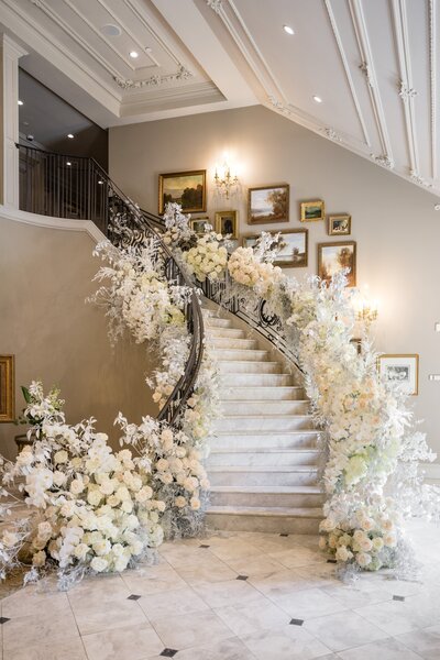 new york wedding planner image of staircase with florals