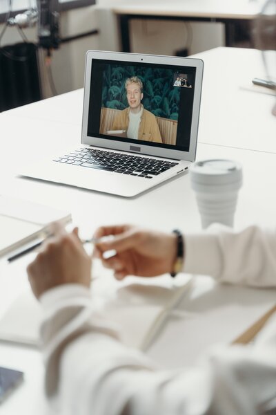 Online meeting seen on laptop