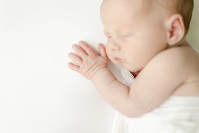 Macro show of newborns wrinkly hand