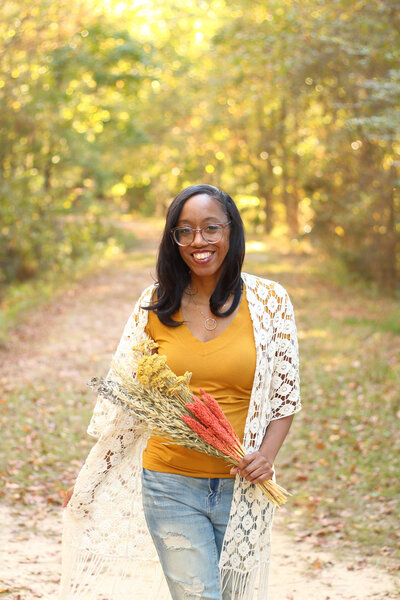Black woman photographer walking on a path in South Carolina, Tracee Gadson