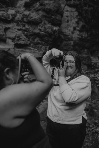 Katelin holding a camera from the angel of Ashley.