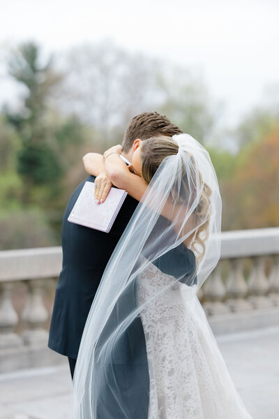 Bride and groom walk up memorial steps at their DC wedding