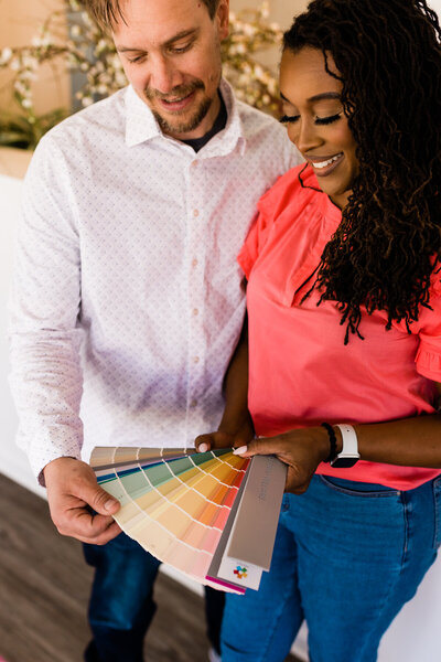 man and woman reviewing color swatches
