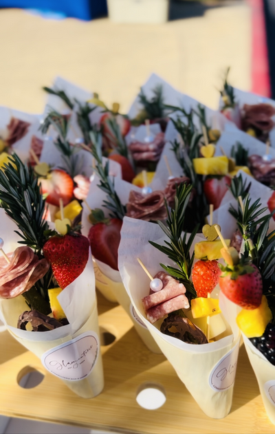 Individual charcuterie cones with meats and fruits
