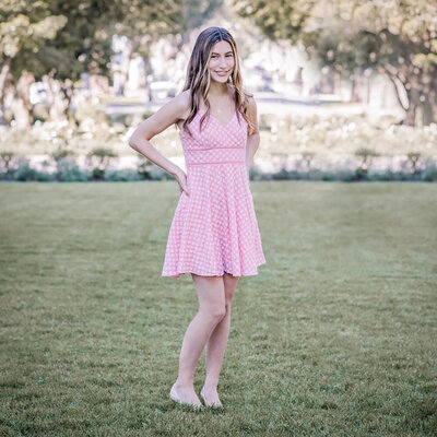senior portrait of a girl ini a pink dress