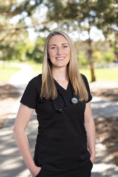 Nicole Mortensen, RN headshot in black scrubs